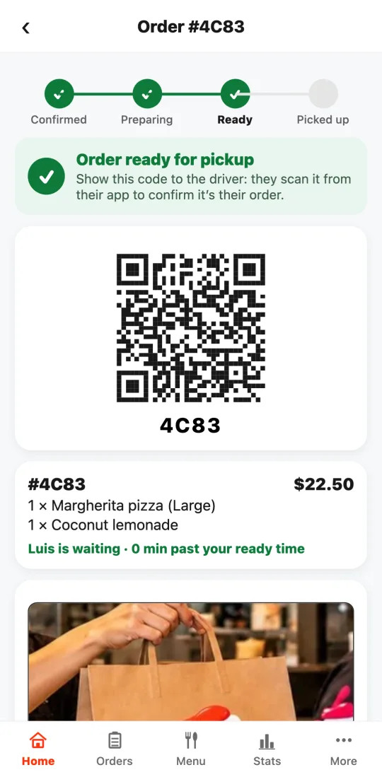 Order ready for pickup with the large code for the driver and the photo of the bag the driver took.